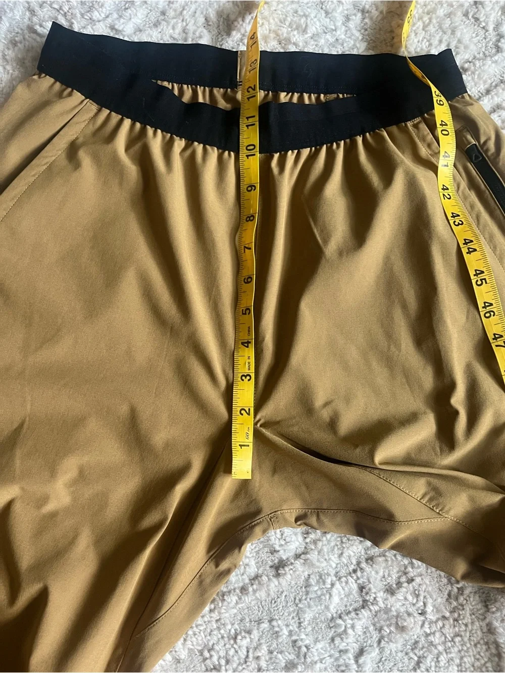The North Face Men’s ESSENTIAL Track/Running pants in Tan with Black Accents